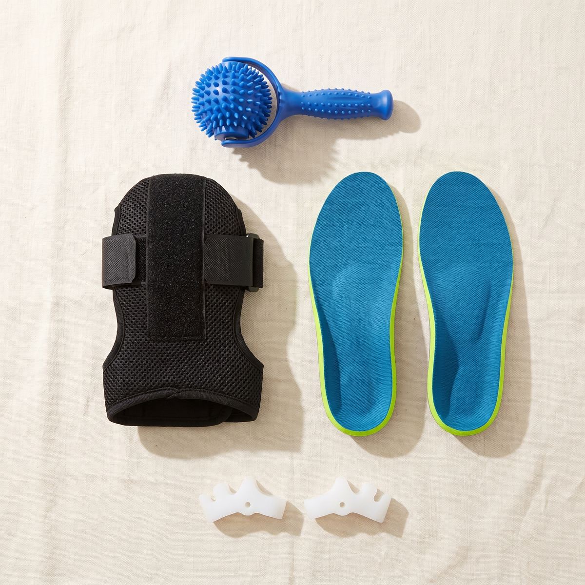The Heel Relief Kit: night splint, massage ball, arch support insoles and toe spacers